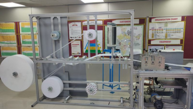 Automatic sanitary pad making machine